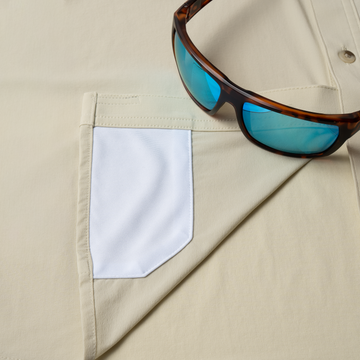 sunglasses with lens cleaner on shirt