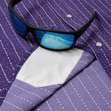 sunglasses with lens cleaner on shirt