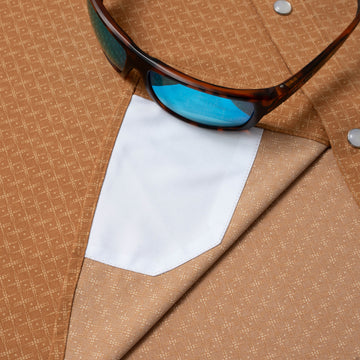 sunglasses with lens cleaner on shirt