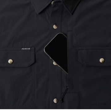 phone in chest zipper pocket of shirt