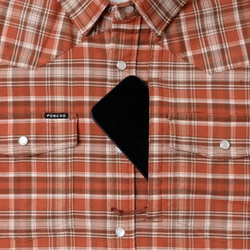 phone in chest zipper pocket of shirt