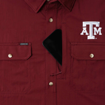 phone in chest zipper pocket of shirt