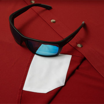 sunglasses with lens cleaner on shirt