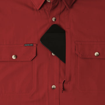 phone in chest zipper pocket of shirt