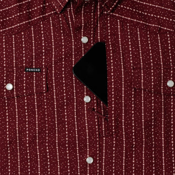 phone in chest zipper pocket of shirt