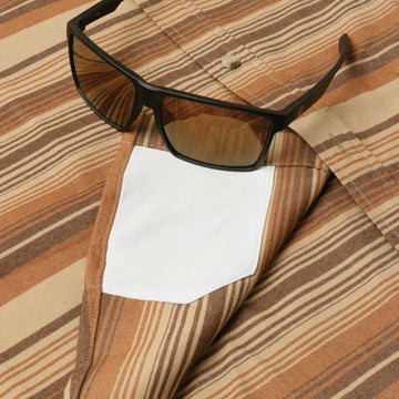 sunglasses with lens cleaner on shirt