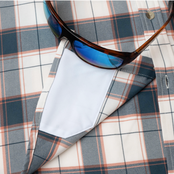 sunglasses with lens cleaner on shirt