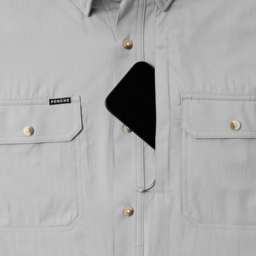 phone in chest zipper pocket of shirt