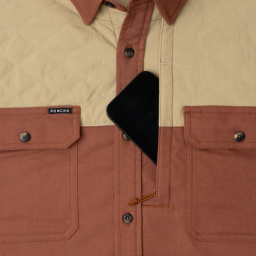 phone in chest zipper pocket of shirt