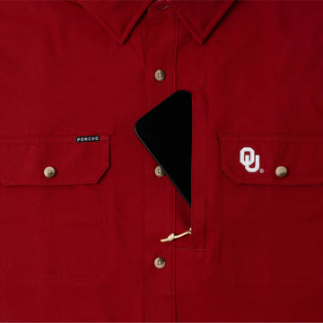 phone in chest zipper pocket of shirt