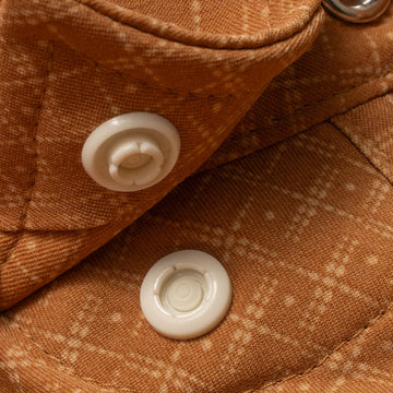 collar snaps on burnt orange shirt