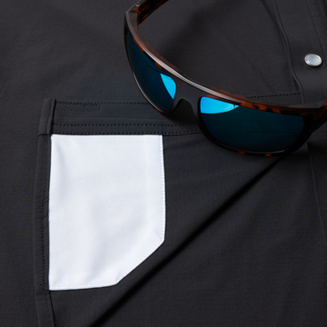 sunglasses with lens cleaner on shirt