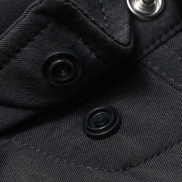 photo of collar snaps on black shirt