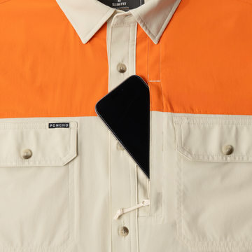 phone in chest zipper pocket of shirt