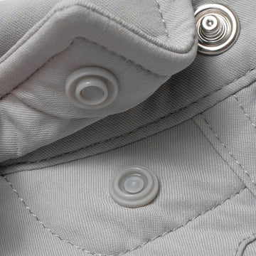 photo of collar snaps on grey shirt