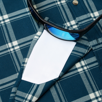 sunglasses with lens cleaner on shirt