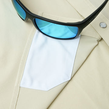 sunglasses with lens cleaner on shirt