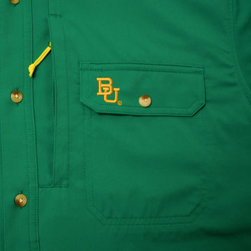 pocket of green shirt with embroidered baylor logo