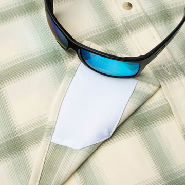 sunglasses with lens cleaner on shirt