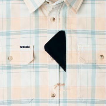 phone in chest zipper pocket of shirt