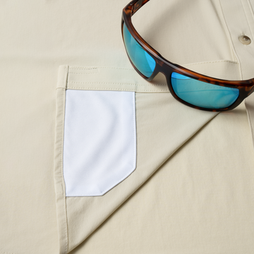 sunglasses with lens cleaner on shirt