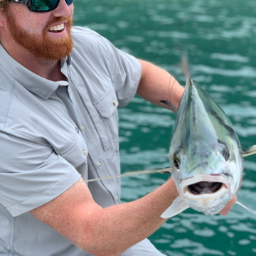 man with fish wearing the grey fox shirt