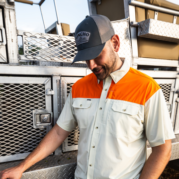 man wearing tan blaze patch short sleeve shirt