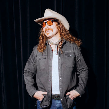 man with cowboy hat wearing after dark shirt