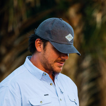 Man wearing grey diamond patch hat