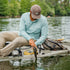 Man catching fish in kayak