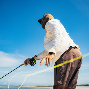 man holding fishing rod