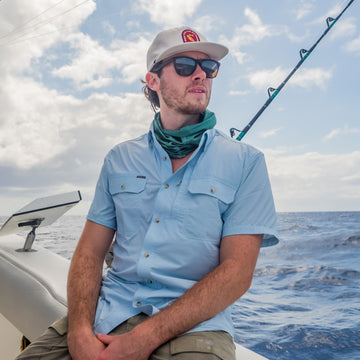 man wearing blue short sleeve shirt