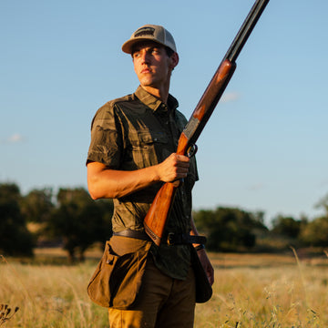 man wearing camo shirt hunting