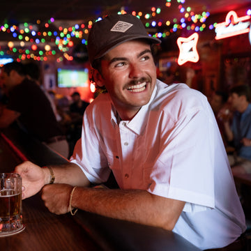man smiling in short sleeve western shirt