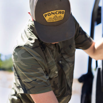 man wearing short sleeve camo shirt