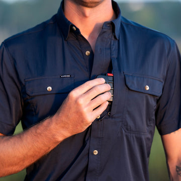 man putting tackle box into chest navy pocket