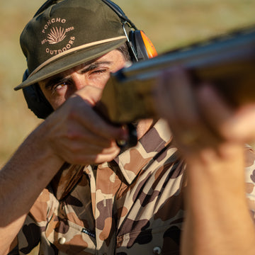 man hunting with camo shirt
