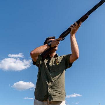 man hunting in green shirt