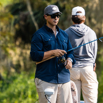 man fishing in navy shirt