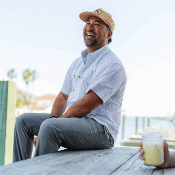 Man Wearing blue and yellow button down shirt