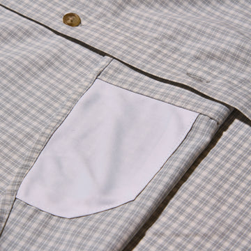 grey and plaid button up sunglass cleaner