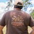 Back of wild game t-shirt of man in woods