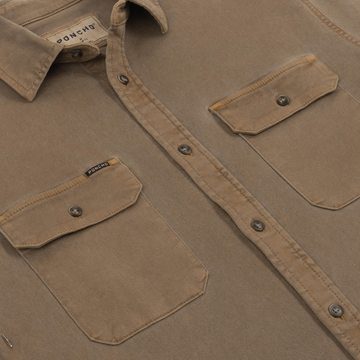 Close-up of The Monteagle brown shirt front with buttoned flap pockets and collar detail