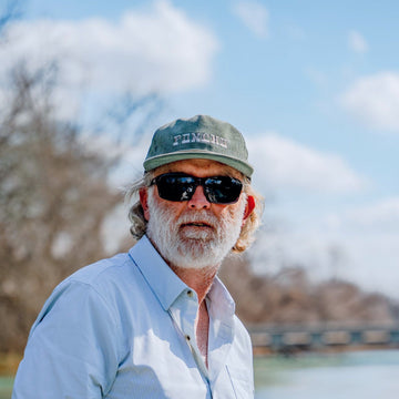 man wearing moss corduroy hat