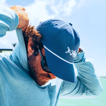 man wearing navy tarpon rope hat