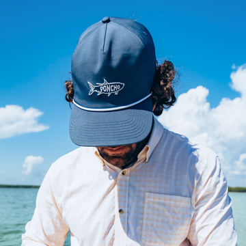 man wearing navy tarpon rope hat
