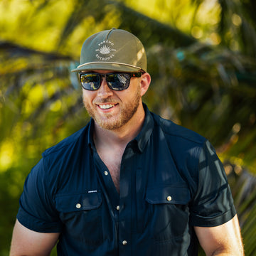 Man wearing navy short sleeve shirt