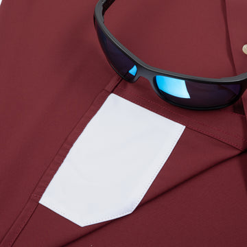 Closeup of sunglasses with lens cleaner on shirt