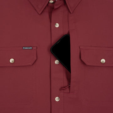 Phone in chest zipper pocket of shirt