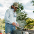 Man cooking wearing olive diamond patch hat